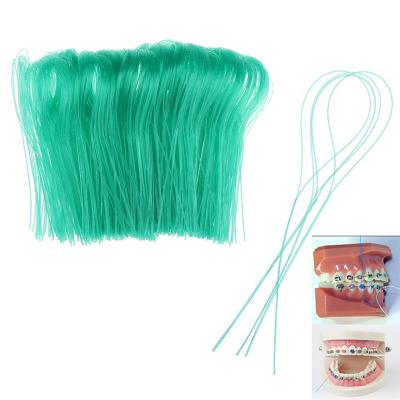 Green floss threader 